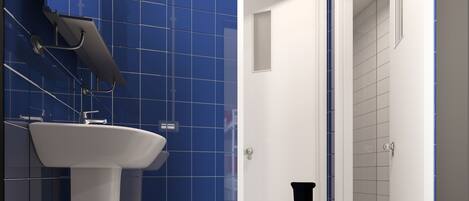 A modern bathroom with a white sink, blue tiles, and a door leading to another room.