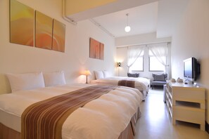 A hotel room with two beds, a TV, a desk, and a window with curtains. - Yago Lodge (New Taipei City)