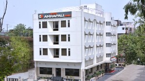 A multi-story hotel with a modern facade, featuring a prominent sign for 'Hotel Amrapali Grand'. - Hotel Amrapali Grand (New Delhi)