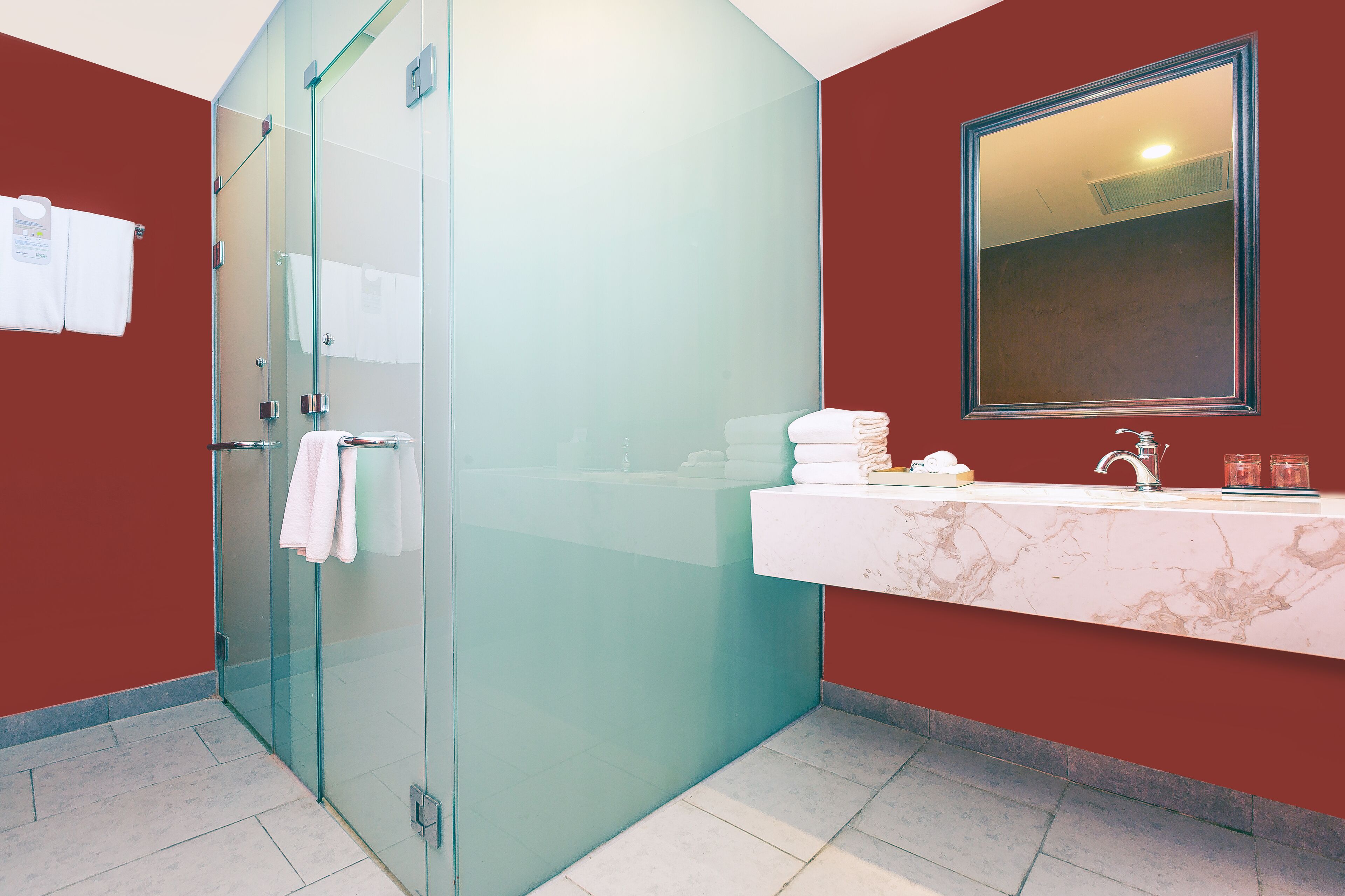 designer toiletries, hair dryer, slippers, towels