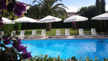 Outdoor pool, pool umbrellas, pool loungers
