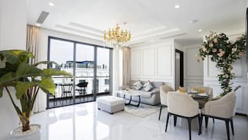 Penthouse Two-bedroom Free One-way Airport Transfer | Living area | 40-inch flat-screen TV with cable channels, TV