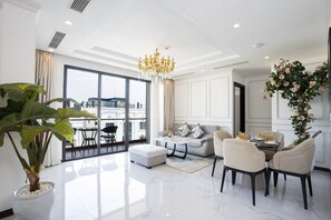 Penthouse Two-bedroom Free One-way Airport Transfer | Living area | 40-inch flat-screen TV with cable channels, TV - Cicilia Hotels & Spa Danang (Da Nang)