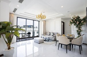 Penthouse Two-bedroom Free One-way Airport Transfer | Living area | 40-inch flat-screen TV with cable channels, TV
