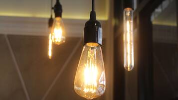 Three hanging light bulbs in a modern interior setting.