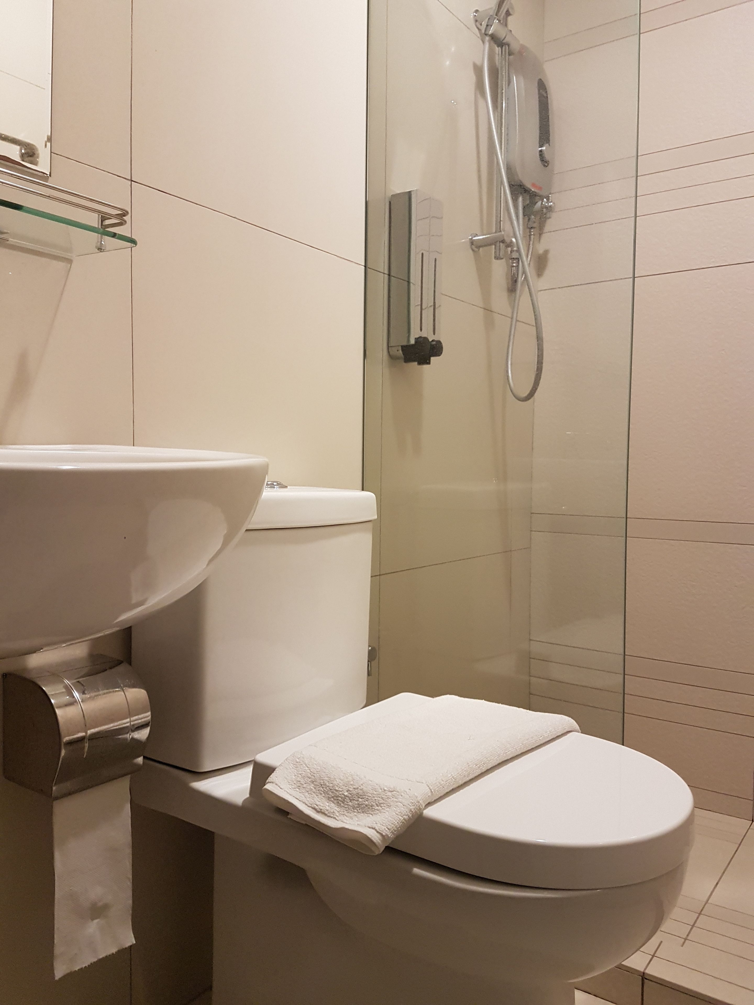 deluxe 4-bed female dorm | bathroom | shower, hydromassage showerhead, bidet, towels