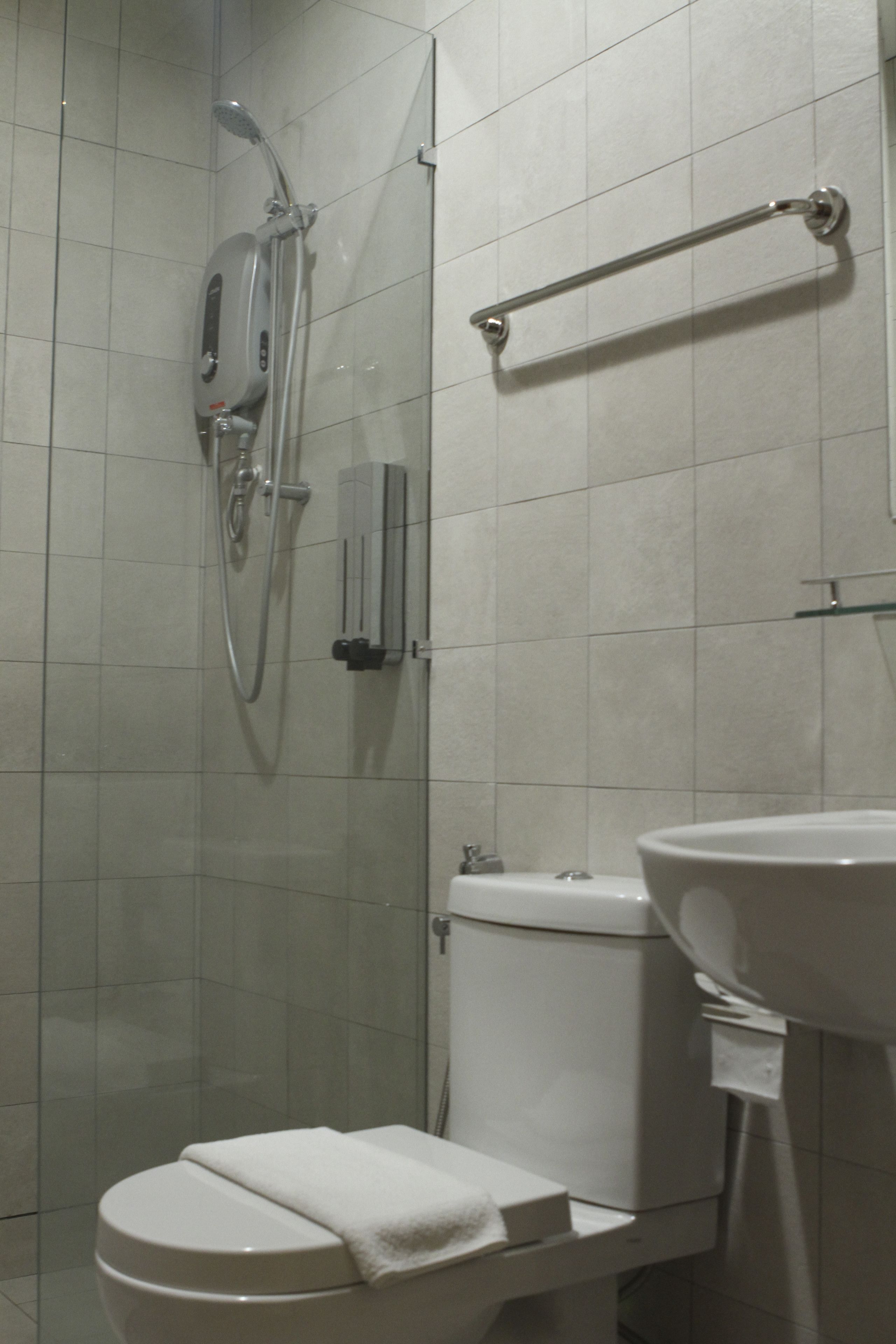 shower, hydromassage showerhead, bidet, towels