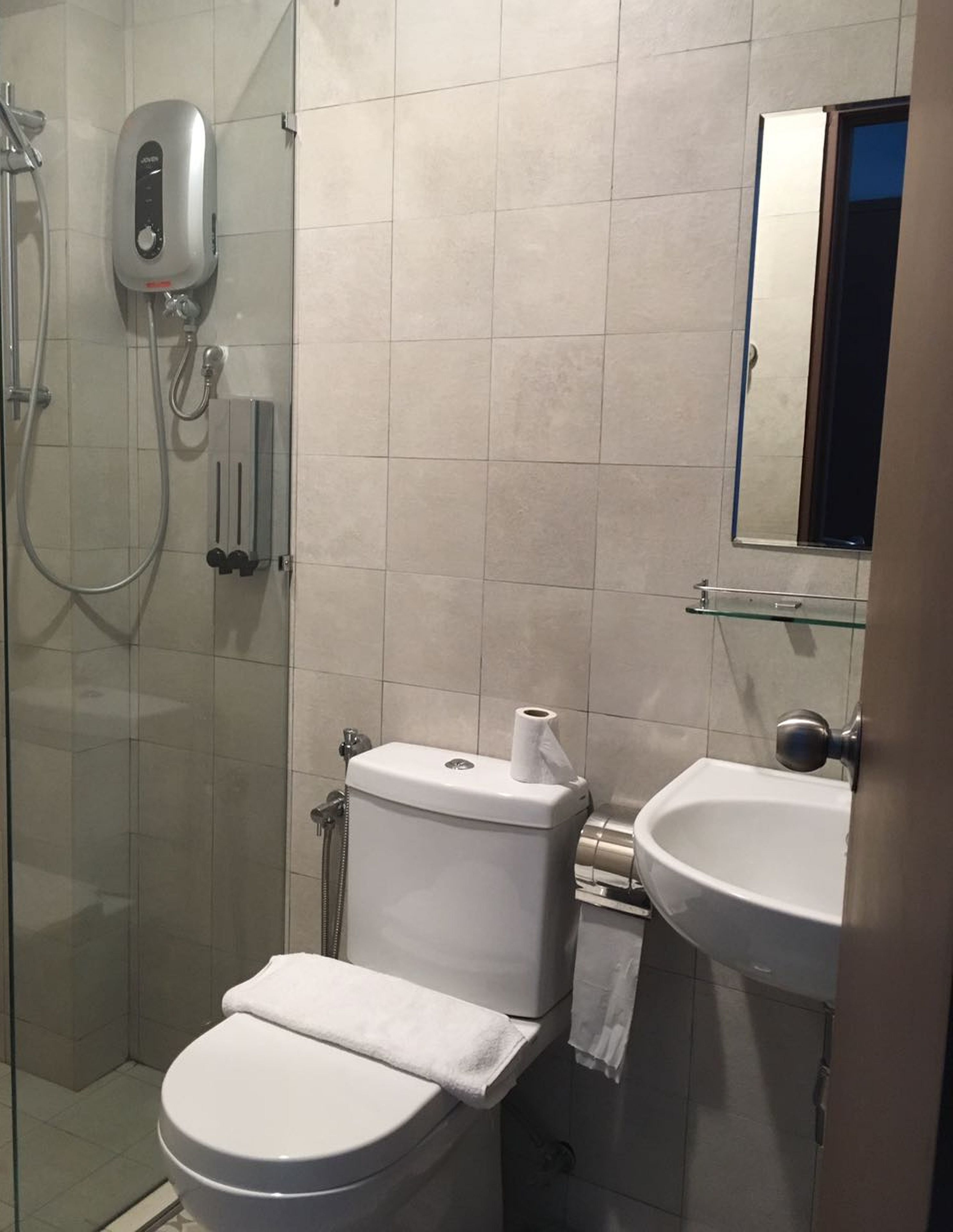 shower, hydromassage showerhead, bidet, towels