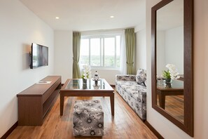 Executive Suite, River View | Living area | 32-inch LCD TV with cable channels, TV - Ben Tre Riverside Resort (Ben Tre)