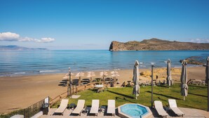 A beachside resort with lounge chairs, umbrellas, and a swimming pool. - Elia Agia Marina Hotel (Chania)