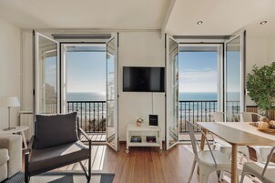 Premium Apartment, 3 Bedrooms, Sea View (Port alegre, 57) | Living area | 43-inch Smart TV with satellite channels