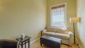 Deluxe Room, 1 King Bed with Sofa bed | Living area | Flat-screen TV