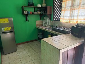 Family Apartment, 2 Bedrooms | Private kitchen | Full-sized fridge, microwave, stovetop, rice cooker