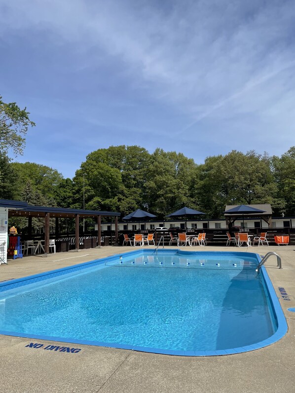 Seasonal outdoor pool, open 10:00 AM to 10:00 PM, free pool cabanas