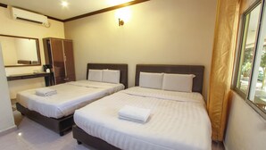 A hotel room with two beds, a wardrobe, a mirror, and an air conditioning unit. - Tanjung Puteri Motel (Langkawi)