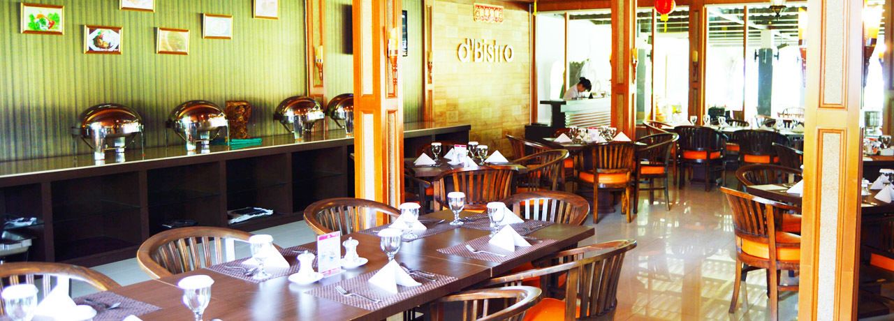 A restaurant with wooden tables and chairs, a buffet counter with food containers, and a sign that reads "Bistro".