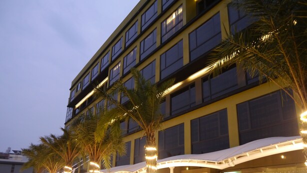 A multi-story hotel with a modern design, featuring balconies and large windows. - Look Royal Resort (Chiayi City)