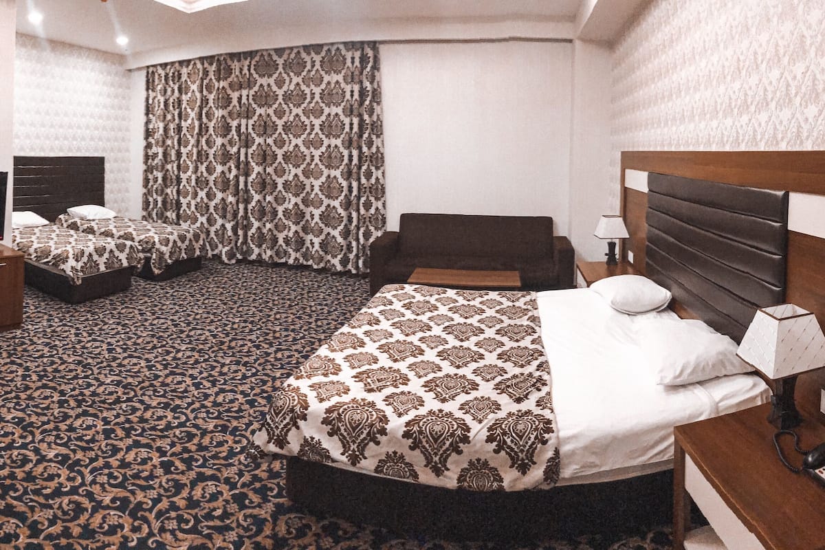 Chambre quadruple Confort | 1 chambre, literie de qualité, minibar, coffre-fort