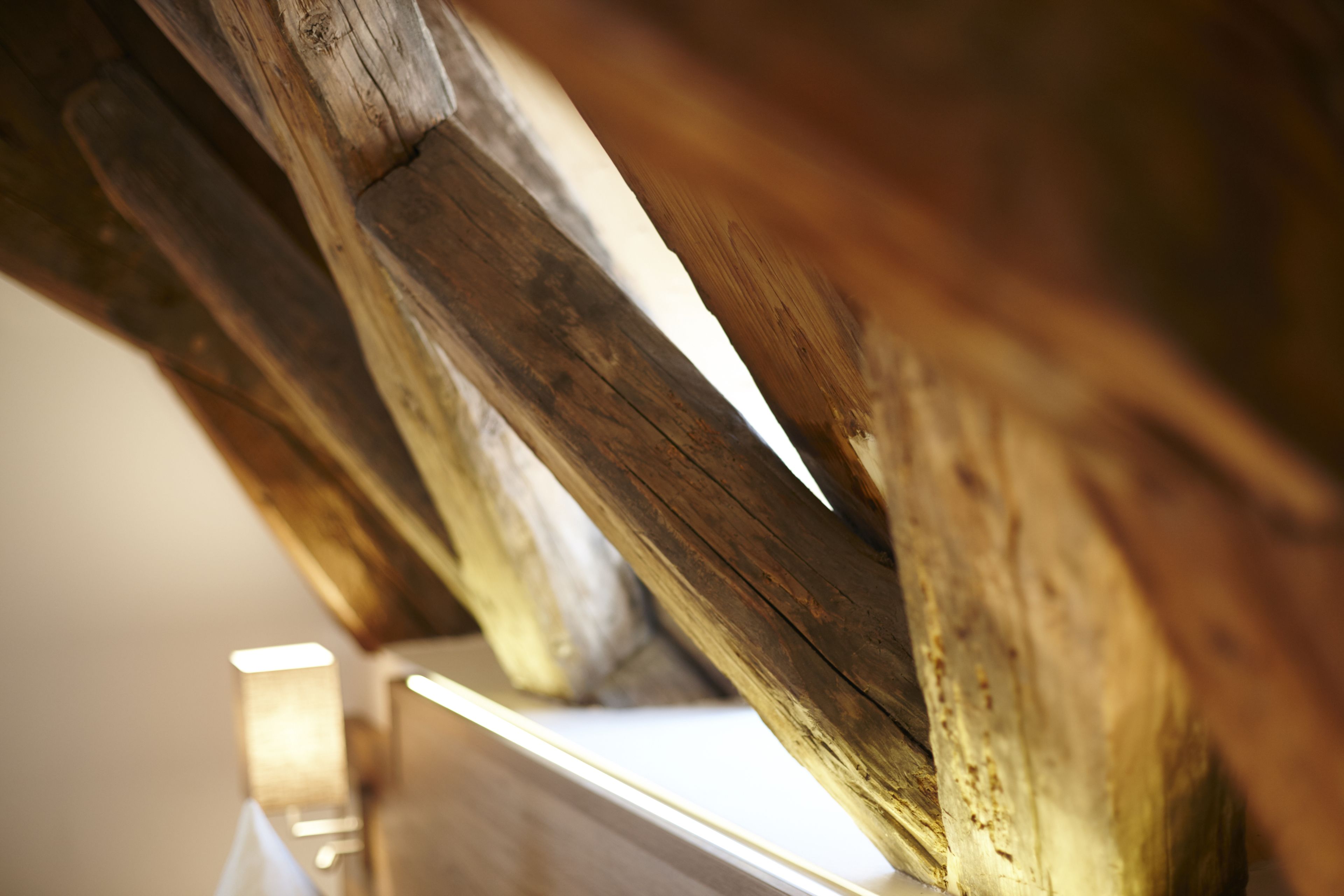 A close-up of a wooden beam structure, likely part of a building's architecture.