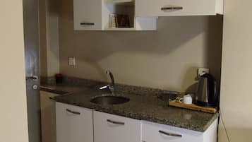 Fridge, coffee/tea maker, electric kettle, cookware/dishes/utensils