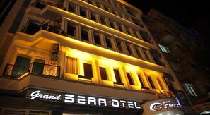 A hotel named "Grand SEARA OTEL" with a classic architectural design, featuring multiple balconies and illuminated windows. - Grand Sera Hotel (Ankara)