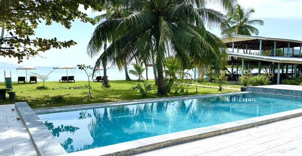 Outdoor pool, open 8:00 AM to 6:00 PM, pool loungers