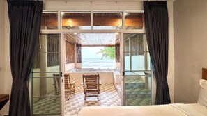 Beachfront Family Pool Villa | In-room safe, laptop workspace, blackout drapes, bed sheets