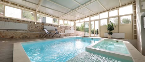 Indoor pool, pool umbrellas, sun loungers
