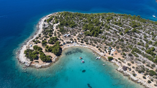 An aerial view of a coastal property with a beach, boats, and a small marina. - Hotel Murter (Murter-Kornati)