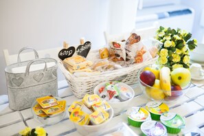 A breakfast buffet with various food items, including fruits, pastries, and yogurt. - B&B Vatican's Keys (Rome)