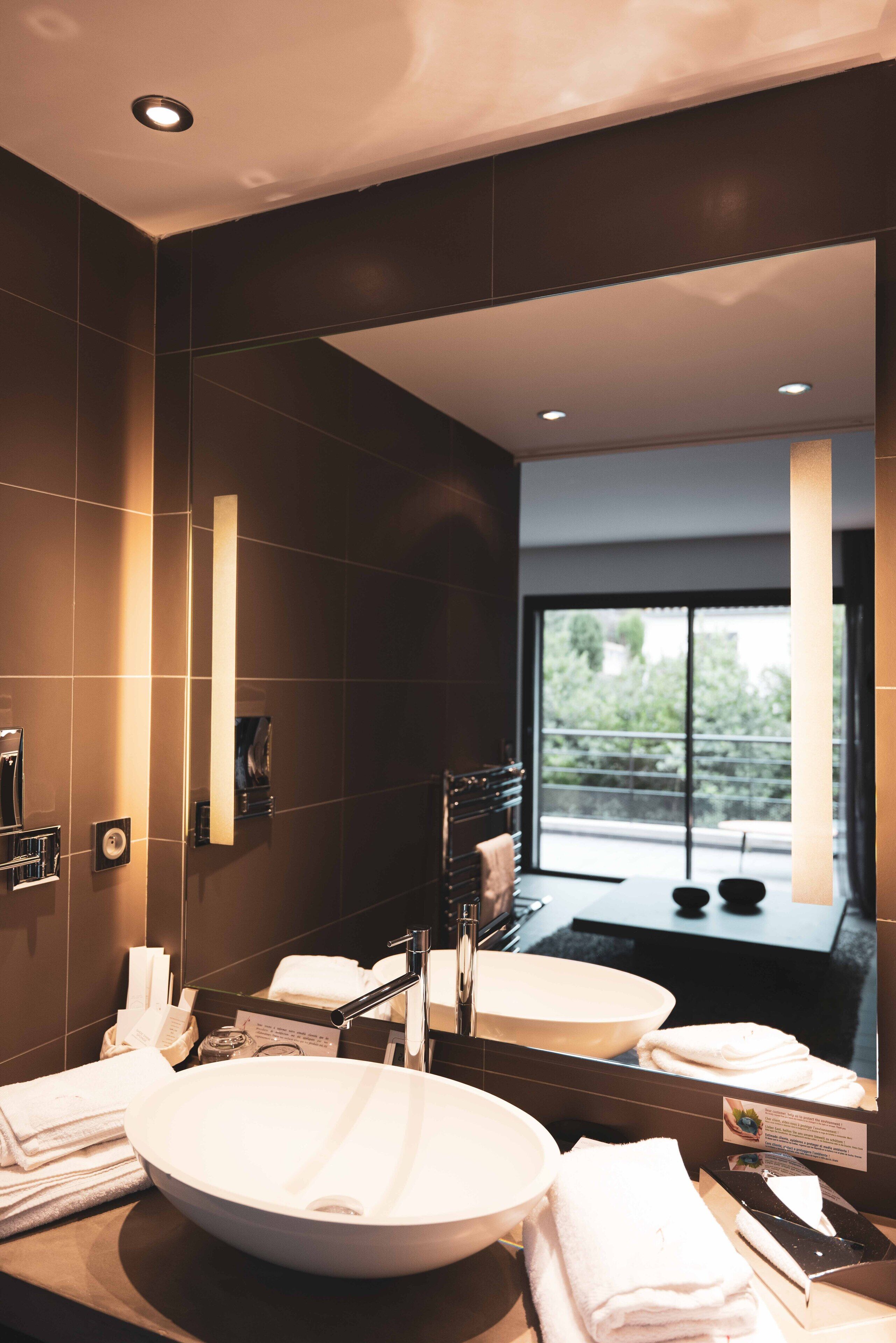 junior suite | bathroom | shower, free toiletries, hair dryer, dressing gowns