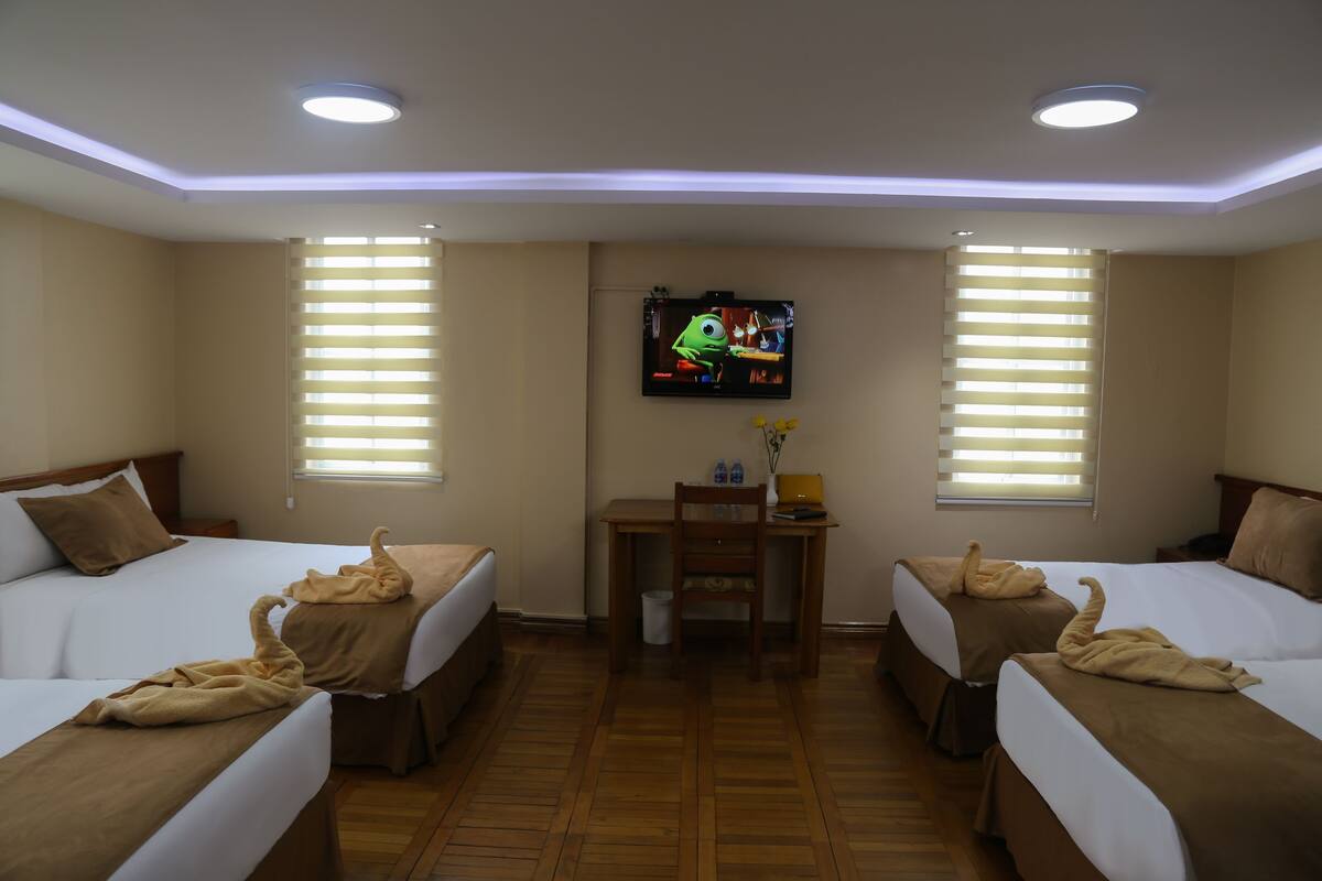 Family Quadruple Room | Premium bedding, in-room safe, desk, laptop workspace