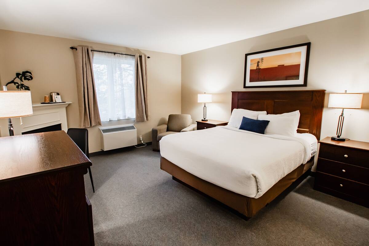 Premium bedding, desk, laptop workspace, blackout drapes