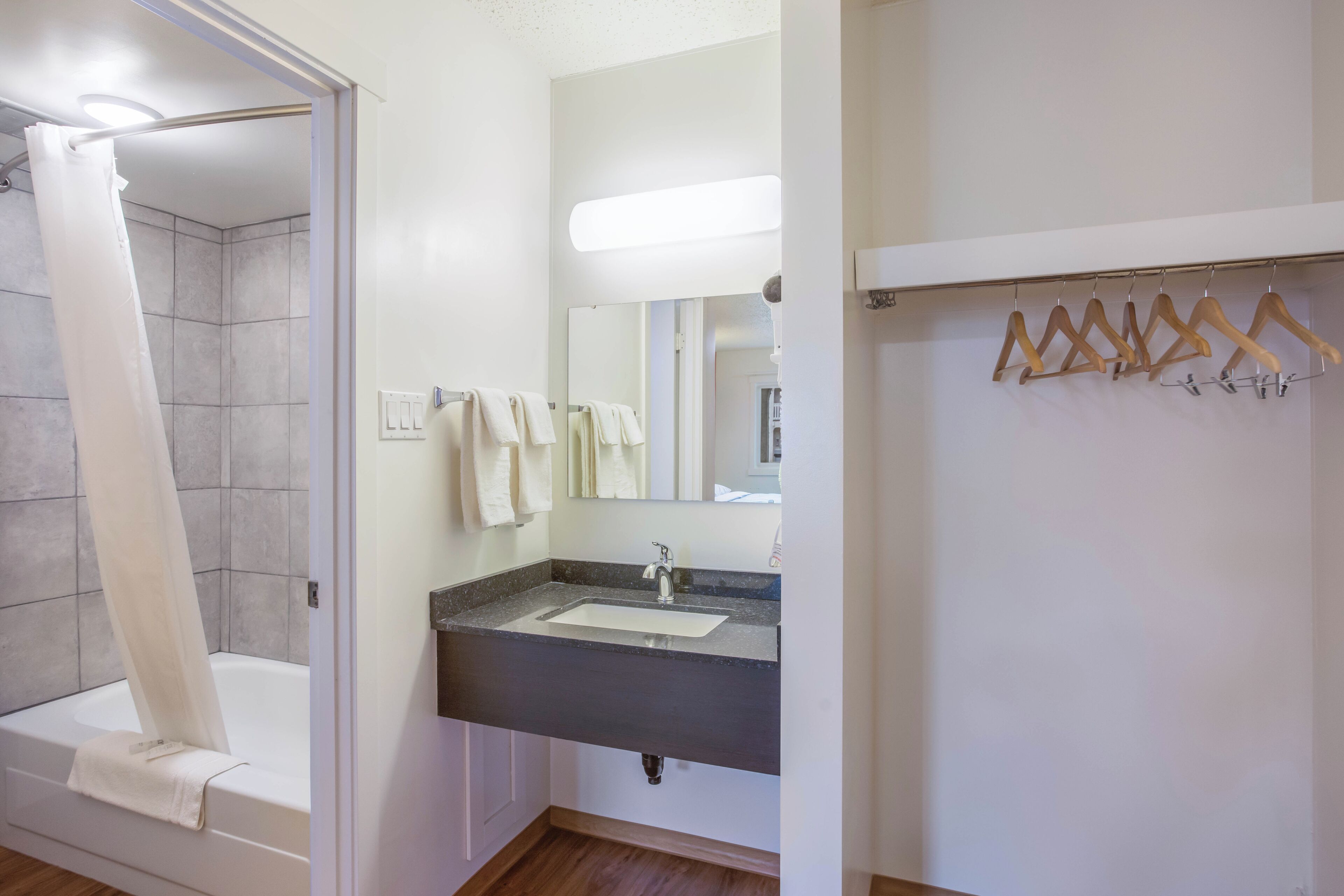 Separate bathtub and shower, towels