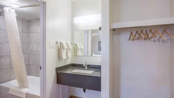 Separate bathtub and shower, towels