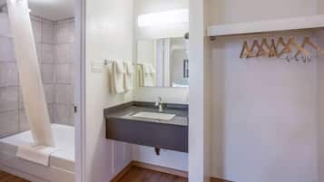 Separate bathtub and shower, towels