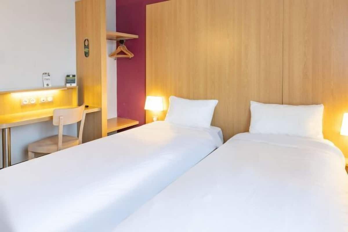 Premium bedding, desk, laptop workspace, soundproofing