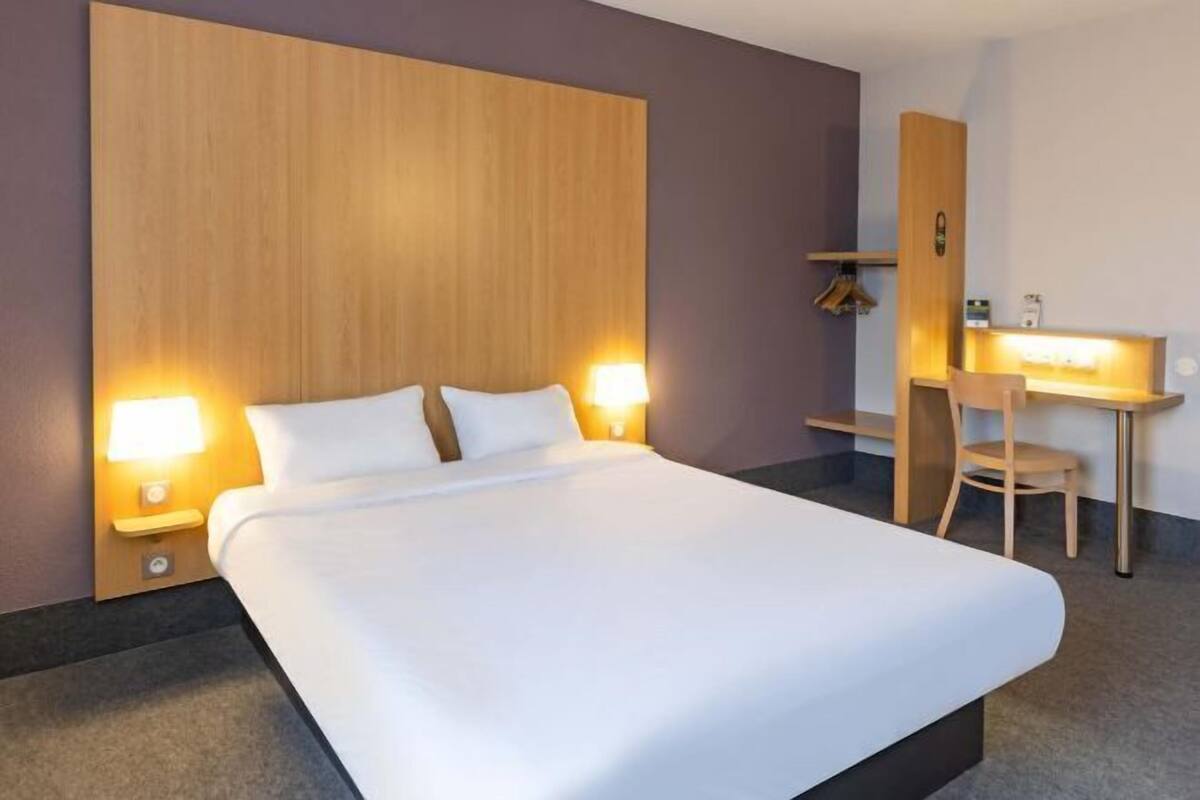 Premium bedding, desk, laptop workspace, soundproofing