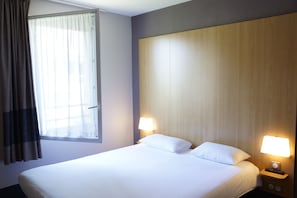 Premium bedding, desk, laptop workspace, soundproofing