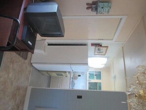 Cottage, 2 Bedrooms (1 king and 2 single beds) | Private kitchen | Fridge, microwave, stovetop, coffee/tea maker