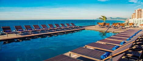 Outdoor pool, open 8:00 AM to 11:00 PM, pool loungers