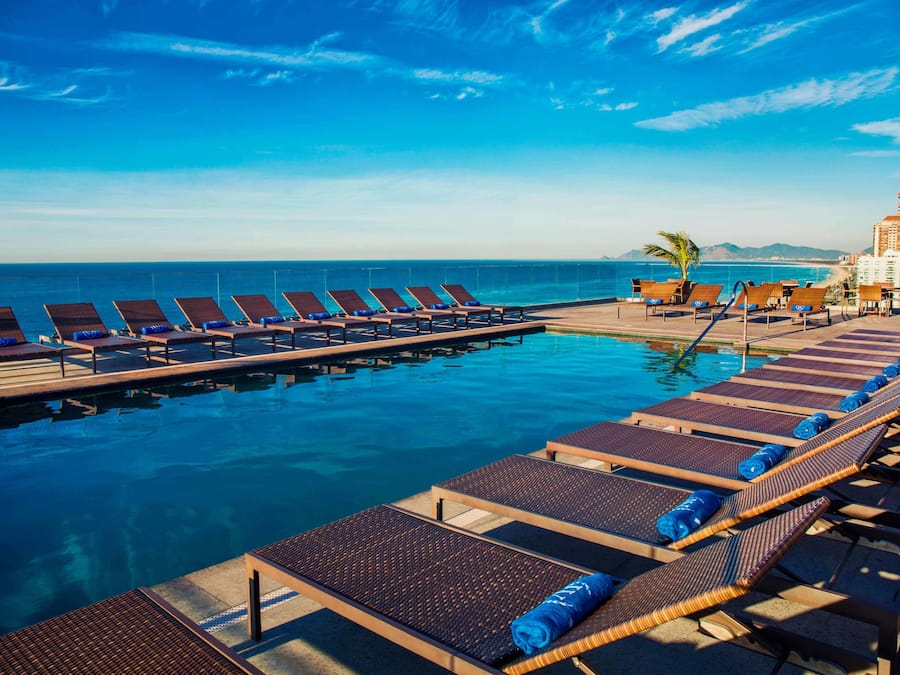 Outdoor pool, open 8:00 AM to 11:00 PM, pool loungers