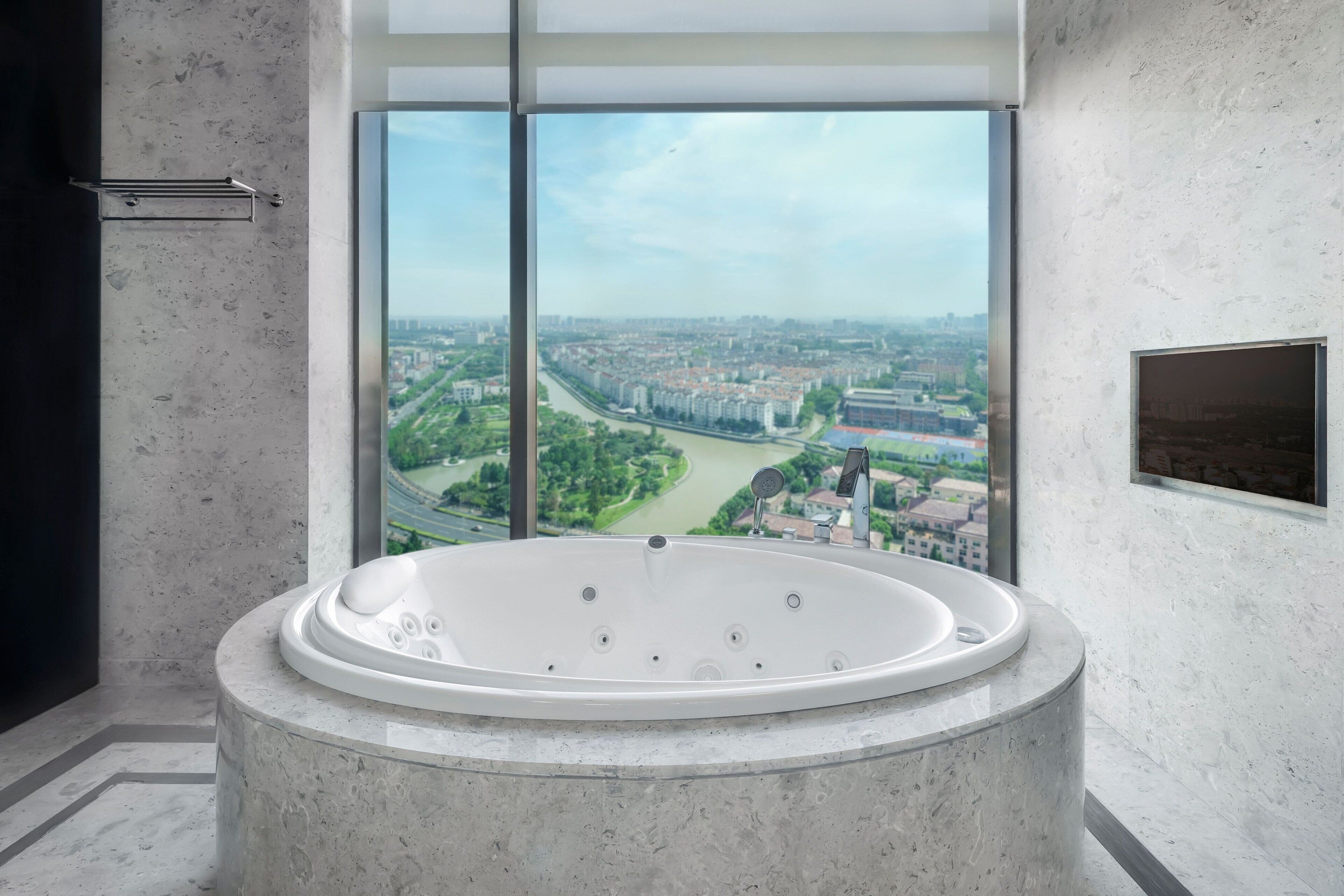 combined shower/bathtub, deep-soaking bathtub, designer toiletries