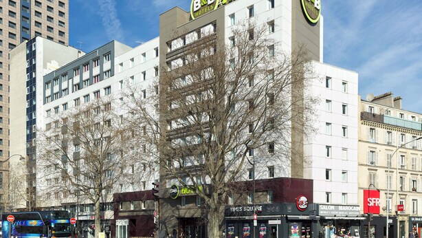 A B&B Hotel building with multiple floors, a Times Squared store, and a Salon Marocain. - B&B HOTEL Paris Porte de la Villette (Aubervilliers)
