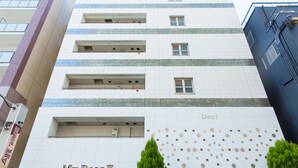 A multi-story building with a sign reading "My Dear II" and a decorative pattern on the facade. - My Dear II - Adults Only (Osaka)