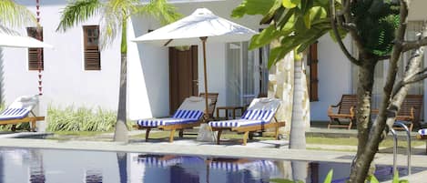 Outdoor pool, open 8:00 AM to 8:00 PM, pool umbrellas, sun loungers