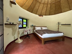 Round House ( Bamboo Room ) | Down comforters, memory foam beds, individually decorated, free WiFi