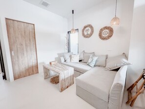 Design Quadruple Room, 1 Queen Bed with Sofa bed | Living area | 50-inch flat-screen TV with digital channels - BeachHouse Geragera (Kobe)
