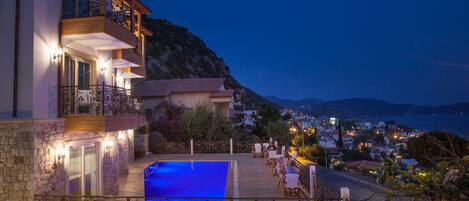 Outdoor pool, a waterfall pool, open 11:00 AM to 7:30 PM, sun loungers
