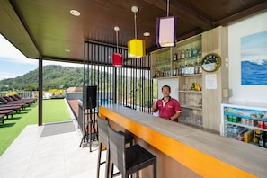 2 outdoor pools, open 10:00 AM to 8:00 PM, pool umbrellas, pool loungers